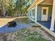 Backyard with fire pit and patio area adjacent to the house at 273 Plantation Ln, Walterboro, SC 29488