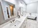Bathroom with double vanity, marble countertop, and free standing tub at 273 Plantation Ln, Walterboro, SC 29488
