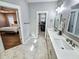 Double vanity bathroom with a view of the bedroom and walk-in closet at 273 Plantation Ln, Walterboro, SC 29488