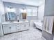 Bathroom with double vanity, freestanding tub, and tile floors at 273 Plantation Ln, Walterboro, SC 29488