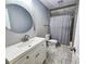 Clean bathroom with white vanity, tile floor, and shower/tub combo at 273 Plantation Ln, Walterboro, SC 29488