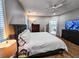 Main bedroom with hardwood floors, large bed and TV at 273 Plantation Ln, Walterboro, SC 29488