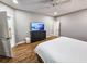Main bedroom with hardwood floors, dresser, and private bathroom access at 273 Plantation Ln, Walterboro, SC 29488