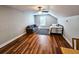 Spacious bonus room with hardwood floors, daybed, and seating area at 273 Plantation Ln, Walterboro, SC 29488