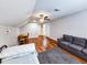 Spacious bonus room with hardwood floors, a sofa, and a small table at 273 Plantation Ln, Walterboro, SC 29488