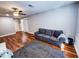 Bright bonus room featuring hardwood floors and a comfortable sofa at 273 Plantation Ln, Walterboro, SC 29488