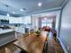 Bright dining area with wooden table and wicker chairs at 273 Plantation Ln, Walterboro, SC 29488