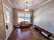 Bright entryway with wood floors, seating area, and coat closet at 273 Plantation Ln, Walterboro, SC 29488