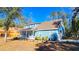 Light blue house with a front porch, side yard, and new construction behind it at 273 Plantation Ln, Walterboro, SC 29488