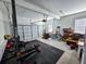 Garage with home gym setup and storage at 273 Plantation Ln, Walterboro, SC 29488
