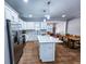Modern kitchen with stainless steel appliances and white cabinets at 273 Plantation Ln, Walterboro, SC 29488