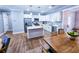 Open concept kitchen with island and stainless steel appliances at 273 Plantation Ln, Walterboro, SC 29488