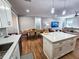 Modern kitchen with white cabinets, quartz countertops and island at 273 Plantation Ln, Walterboro, SC 29488