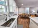 Modern kitchen sink with a sleek faucet and white cabinets at 273 Plantation Ln, Walterboro, SC 29488