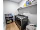 Laundry room with washer, dryer, and additional storage shelving at 273 Plantation Ln, Walterboro, SC 29488