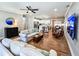 Open concept living space with hardwood floors and a view into the kitchen at 273 Plantation Ln, Walterboro, SC 29488