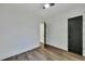 Well-lit bedroom with hardwood floors and a door to the hallway at 2943 Alabama Dr, North Charleston, SC 29405