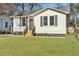 Charming white house with gray shutters, new landscaping, and a well-maintained lawn at 2943 Alabama Dr, North Charleston, SC 29405