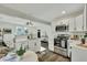 Bright kitchen featuring white shaker cabinets, stainless steel appliances, and an eat-in island at 2943 Alabama Dr, North Charleston, SC 29405