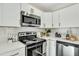 White kitchen with stainless steel appliances and subway tile backsplash at 2943 Alabama Dr, North Charleston, SC 29405