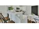 White kitchen with breakfast bar, stainless steel appliances and dining area at 2943 Alabama Dr, North Charleston, SC 29405