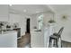 Modern white kitchen with stainless steel appliances and breakfast bar at 2943 Alabama Dr, North Charleston, SC 29405