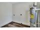 Laundry room with new water heater and vinyl flooring at 2943 Alabama Dr, North Charleston, SC 29405