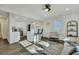Bright living room with hardwood floors, modern furniture, and kitchen view at 2943 Alabama Dr, North Charleston, SC 29405
