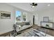 Spacious living room featuring hardwood floors, a comfy couch, and large windows at 2943 Alabama Dr, North Charleston, SC 29405