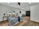 Main bedroom with hardwood floors, and ceiling fan, and access to a sitting area at 2943 Alabama Dr, North Charleston, SC 29405