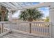 Covered balcony offering peaceful lake and neighborhood views at 2978 Sugarberry Ln, Johns Island, SC 29455