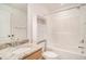 Neat bathroom with granite countertop, wood cabinets, and a shower/tub combo at 2978 Sugarberry Ln, Johns Island, SC 29455