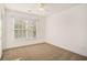 Bright bedroom with neutral carpeting and large window at 2978 Sugarberry Ln, Johns Island, SC 29455