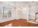Bright dining room with hardwood floors and chandelier at 2978 Sugarberry Ln, Johns Island, SC 29455