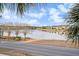 Scenic view of lake, walking path, and neighborhood homes at 2978 Sugarberry Ln, Johns Island, SC 29455