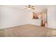 Living room with open kitchen, neutral carpet, and ceiling fan at 2978 Sugarberry Ln, Johns Island, SC 29455