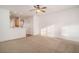 Living room with open kitchen, neutral carpet, and ceiling fan at 2978 Sugarberry Ln, Johns Island, SC 29455