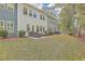 Large backyard with grassy area and patio with seating at 3012 Emma Ln, Mount Pleasant, SC 29466