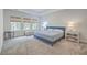 Comfortable bedroom with blue upholstered bed and window seat at 3012 Emma Ln, Mount Pleasant, SC 29466