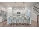 Bright kitchen featuring white cabinets, island with seating, and stainless steel appliances at 3012 Emma Ln, Mount Pleasant, SC 29466