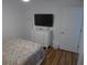 Bedroom with dresser, TV, and patterned bedding at 345 Sea Cloud Cir # 345, Edisto Island, SC 29438