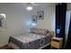 Serene bedroom with patterned bedding, nightstands, and window curtains at 345 Sea Cloud Cir # 345, Edisto Island, SC 29438