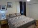 Bedroom with patterned bedding, nightstands, and window curtains at 345 Sea Cloud Cir # 345, Edisto Island, SC 29438