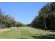 Green golf course fairway with players in the distance at 345 Sea Cloud Cir # 345, Edisto Island, SC 29438