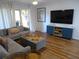 Living room with sectional sofa, large TV, and wood-look flooring at 345 Sea Cloud Cir # 345, Edisto Island, SC 29438