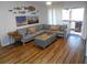 Living room with sectional sofa, ottoman and wood-look flooring at 345 Sea Cloud Cir # 345, Edisto Island, SC 29438