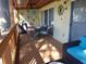 Relaxing screened porch with patio furniture and grill, perfect for outdoor dining at 345 Sea Cloud Cir # 345, Edisto Island, SC 29438