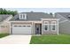 Gray two-story house with white garage and blue door at 418 Evening Glow Ln, Summerville, SC 29486