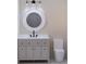 Bathroom vanity with a large round mirror and gray cabinets at 420 Greenwich St, Mount Pleasant, SC 29464