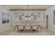 Modern dining area with light wood table and chairs at 420 Greenwich St, Mount Pleasant, SC 29464